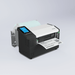 Label printer with a roll of paper on a light gray background