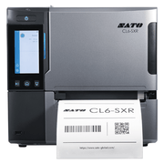 A silver and black SATO CL4-SXR industrial label printer with a front display screen and a white label being printed, shown on a plain white background.