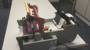 The BL-200 label applicator will put a label onto virtually any round product. The BL-200 uses a three roller system, pinching the product accurately to ensure a smooth rotation and application or the label.