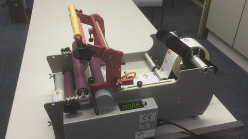 The BL-200 label applicator will put a label onto virtually any round product. The BL-200 uses a three roller system, pinching the product accurately to ensure a smooth rotation and application or the label.