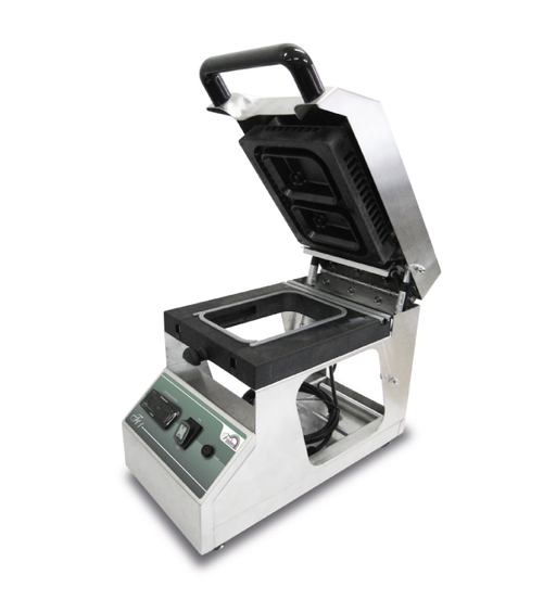 The Friulmed FT1 tray thermosealing machine with manual temperature regulation, ensuring a perfect seal even when the contact area contains grease, fat, etc.  The FT1 uses a patented SLEDGE SYSTEM to enable the sealing of different tray sizes & the fixed work level guarantees sealing on each edge.